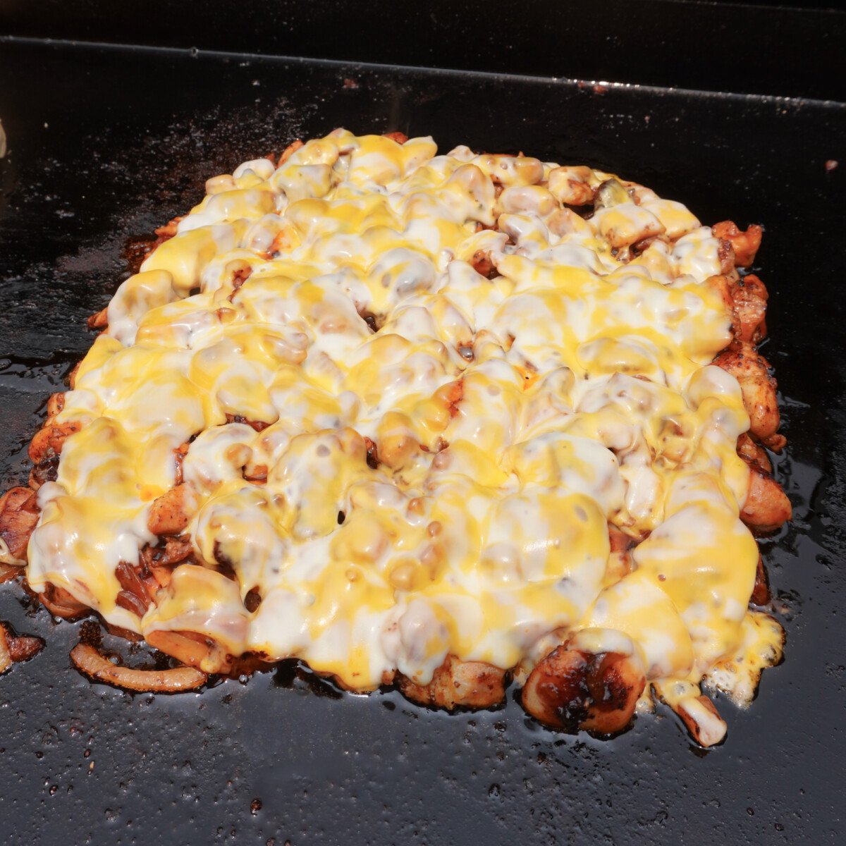 bbq chicken with melted colby jack cheese on top.