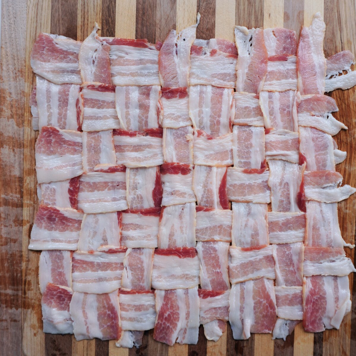 Bacon weave on a cutting board.