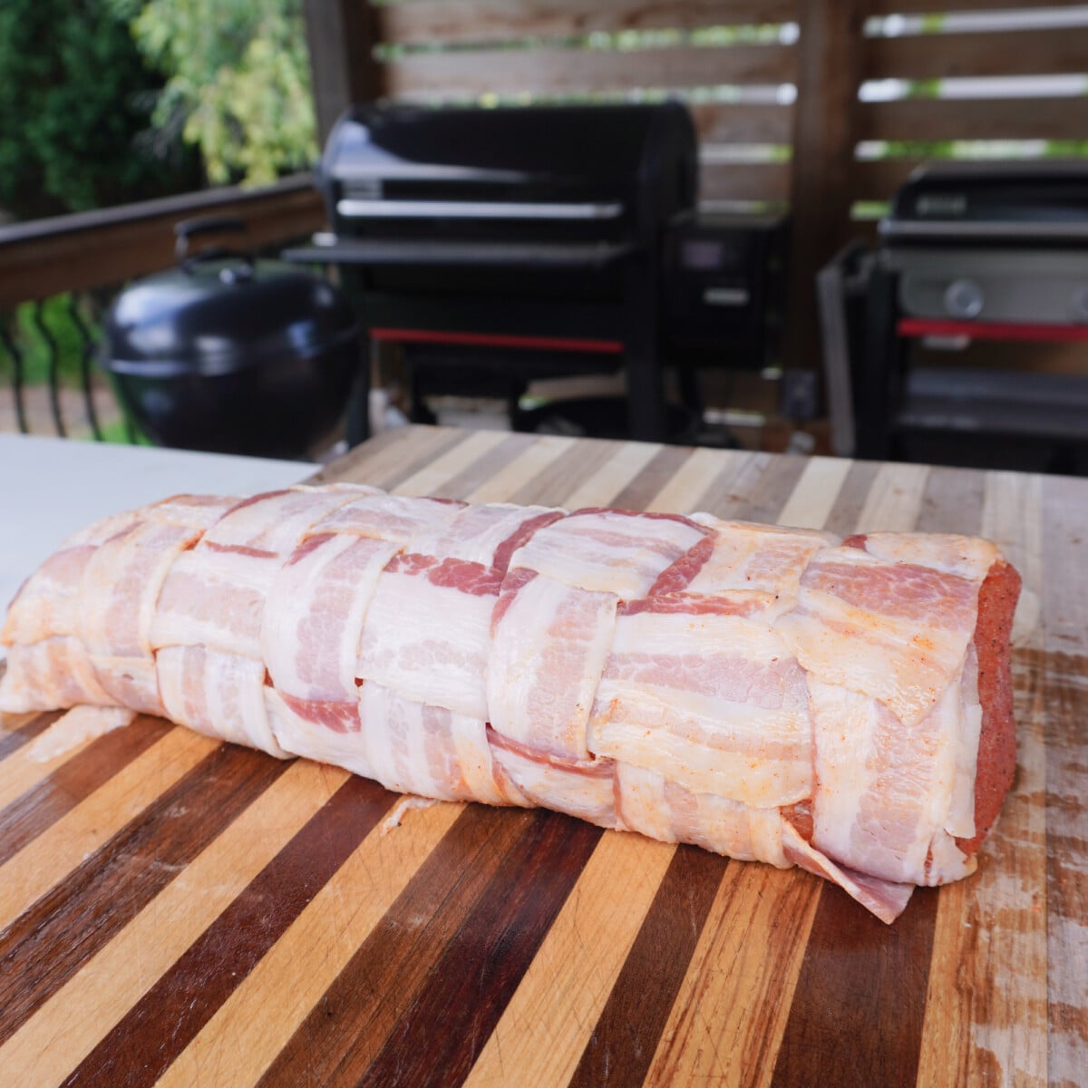 raw bacon wrapped pork loin.
