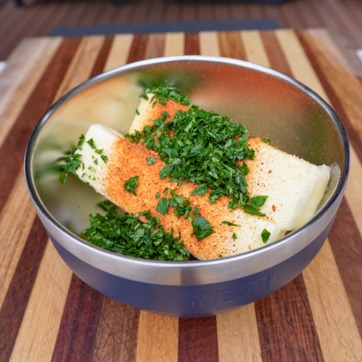 raw ingredients in a bowl for the cajun honey compound butter.