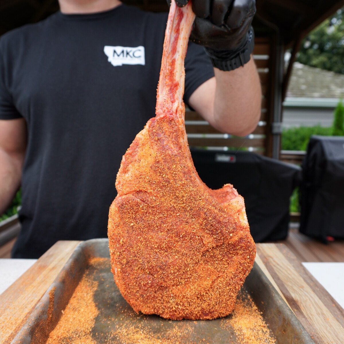 upright seasoned tomahawk steak.