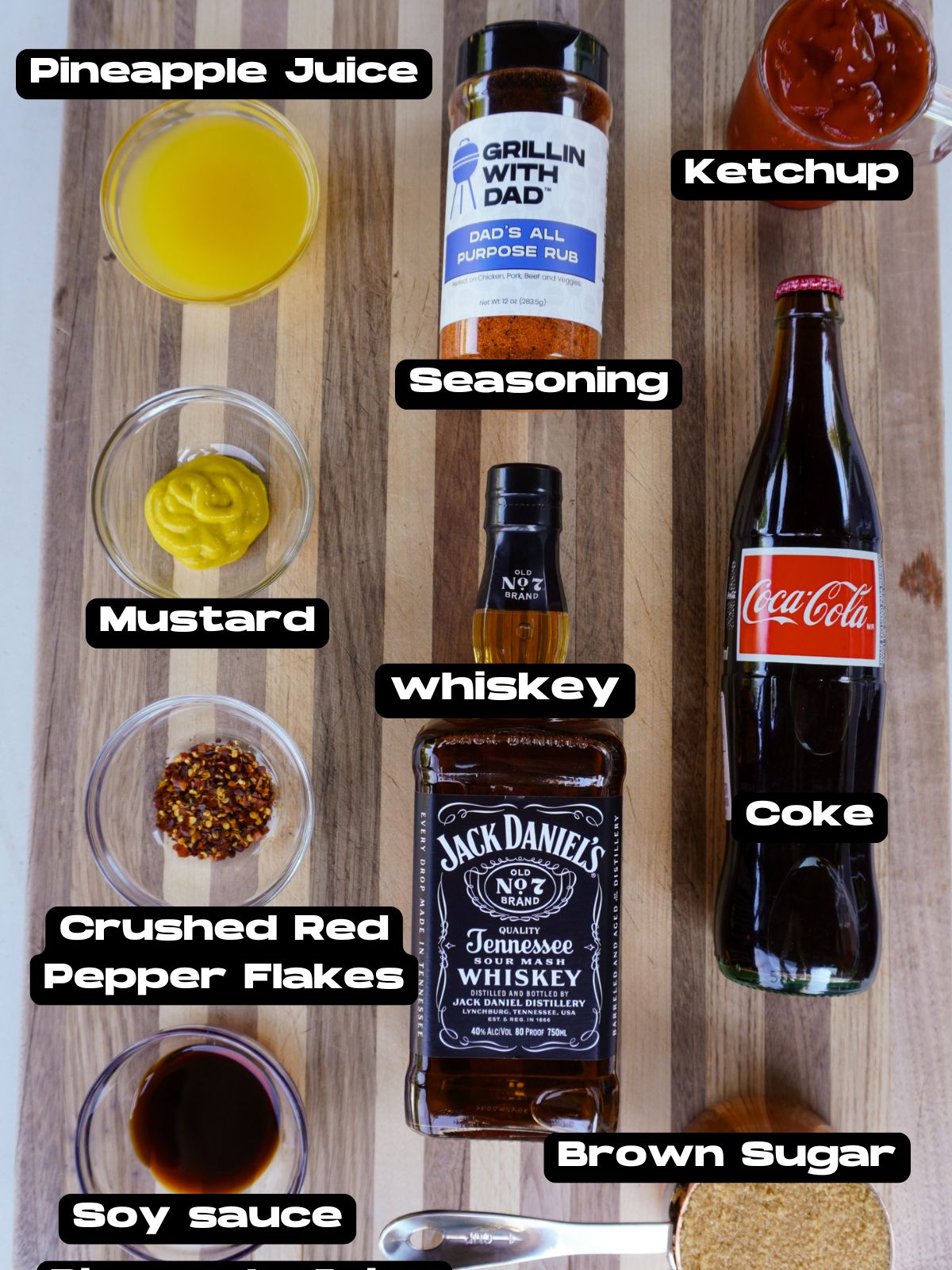 Ingredients needed to make a homemade Jack and Coke BBQ sauce.