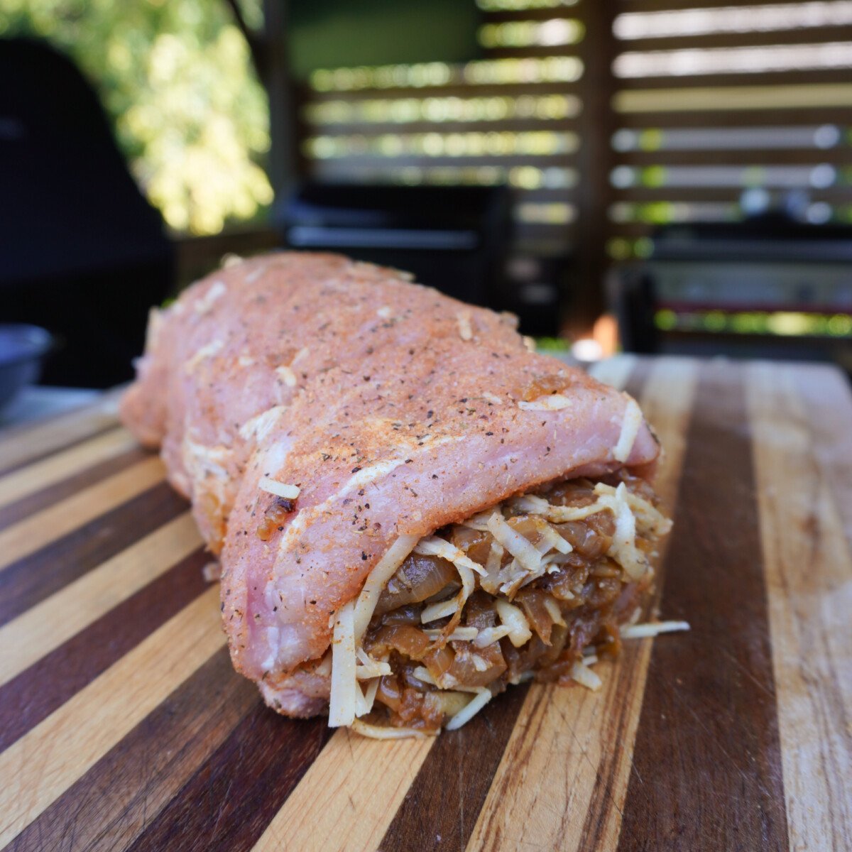 Rolled and stuffed raw french onion pork loin.