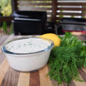 easy homemade ranch dressing with a side of herbs and lemon.