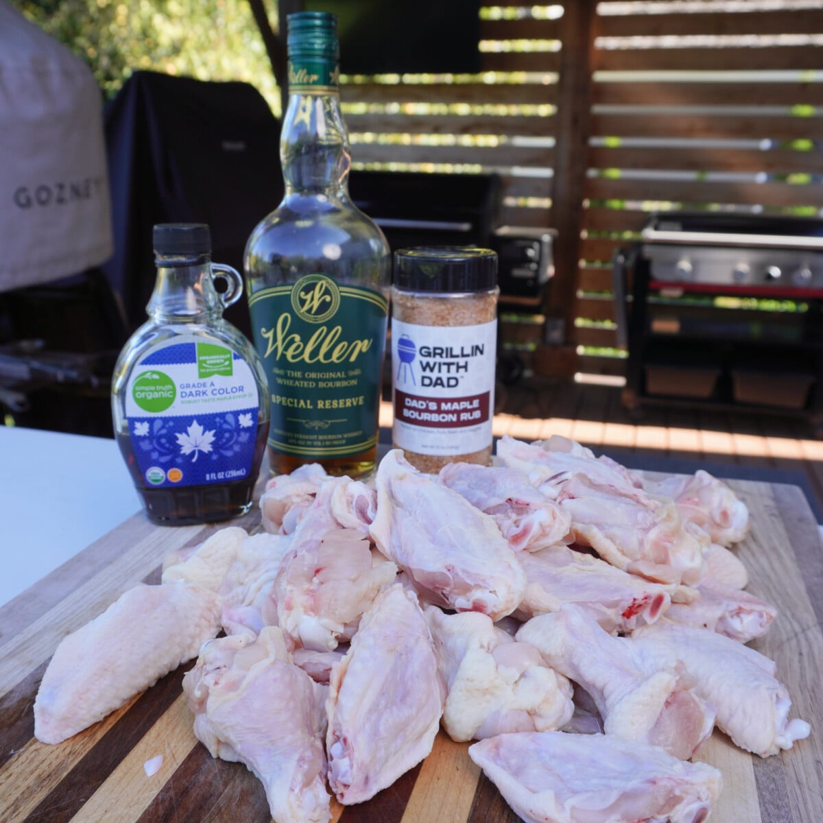 smoked maple bourbon wing ingredients on a cutting board outside on the deck.