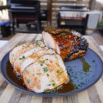 Grilled Apple Cider Pork Roast sliced and plated.