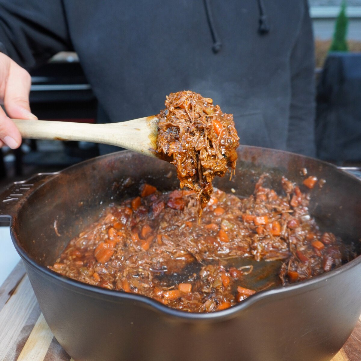 a spoonful of grilled short ribs ragu mixture.
