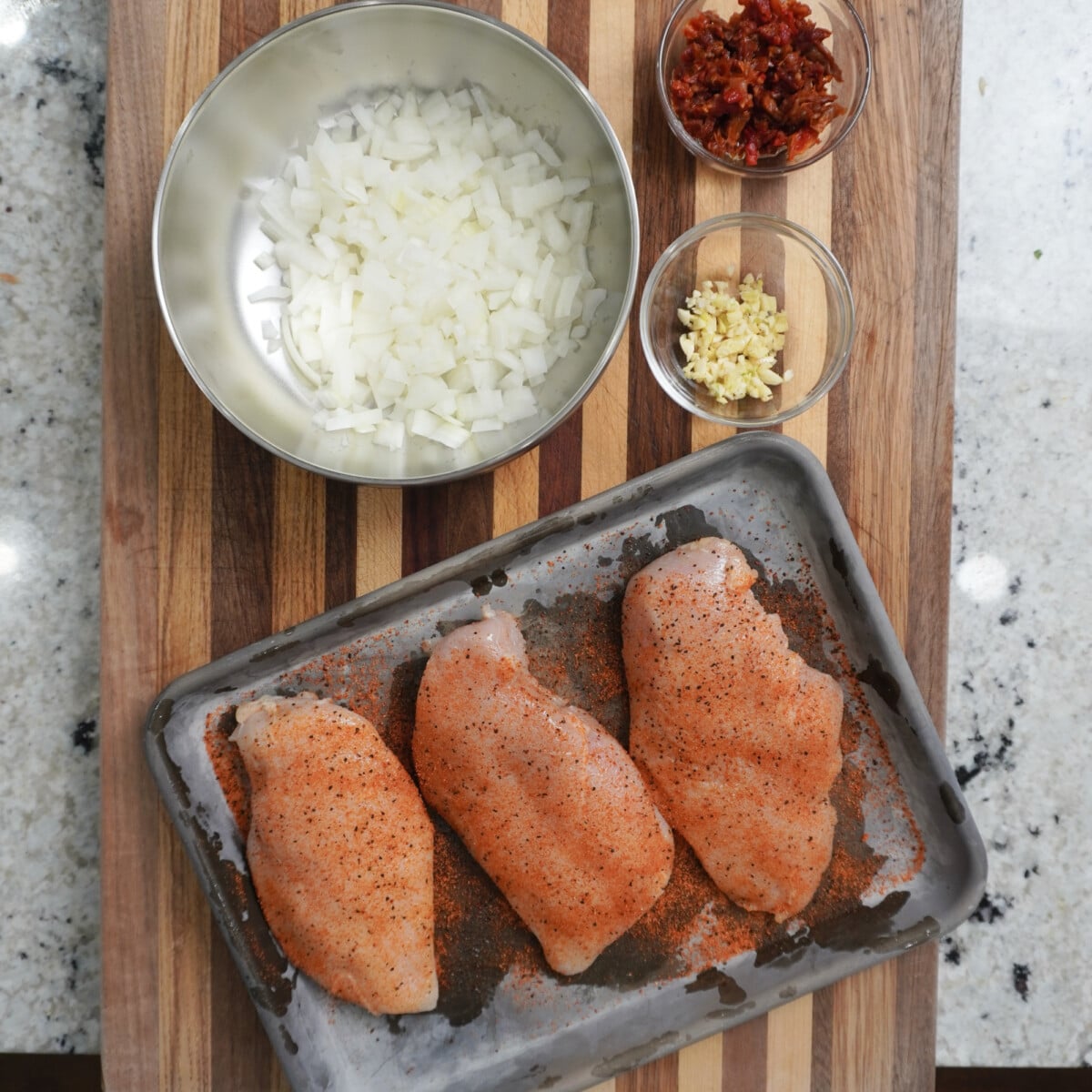 Seasoned chicken and chopped veggies.