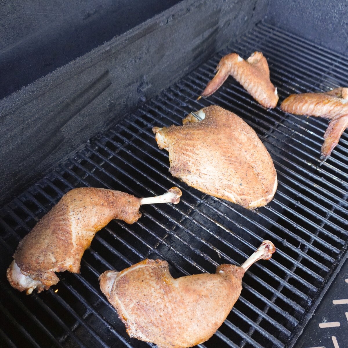 sweet tea brined grilled turkey pieces on the grill.