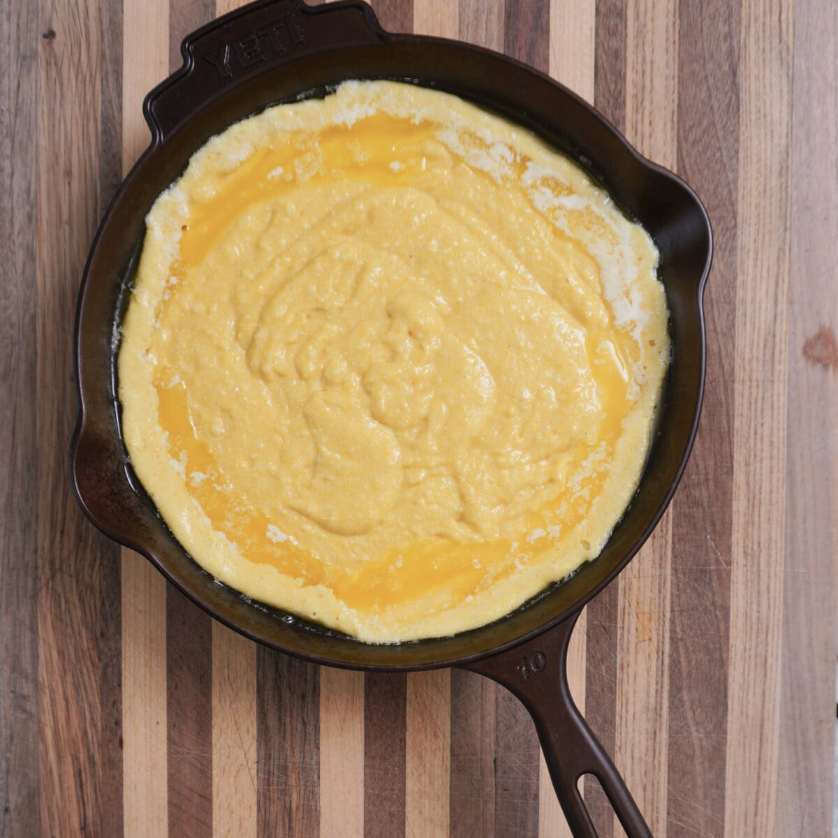 easy homemade cornbread batter in a cast iron skillet.