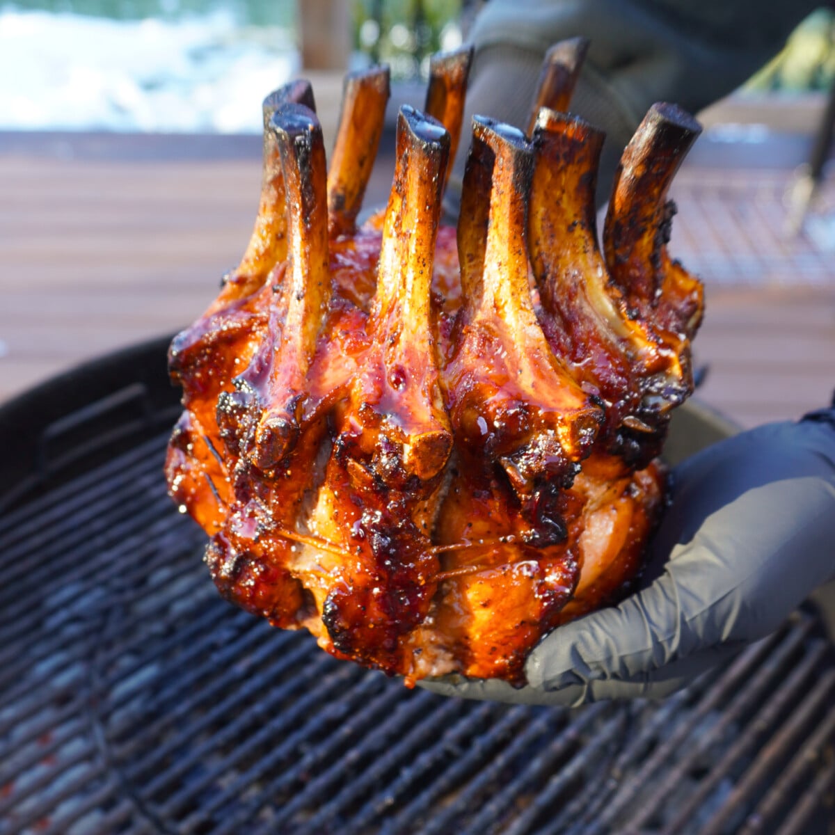 Holiday Crown Roast over a charcoal grill.