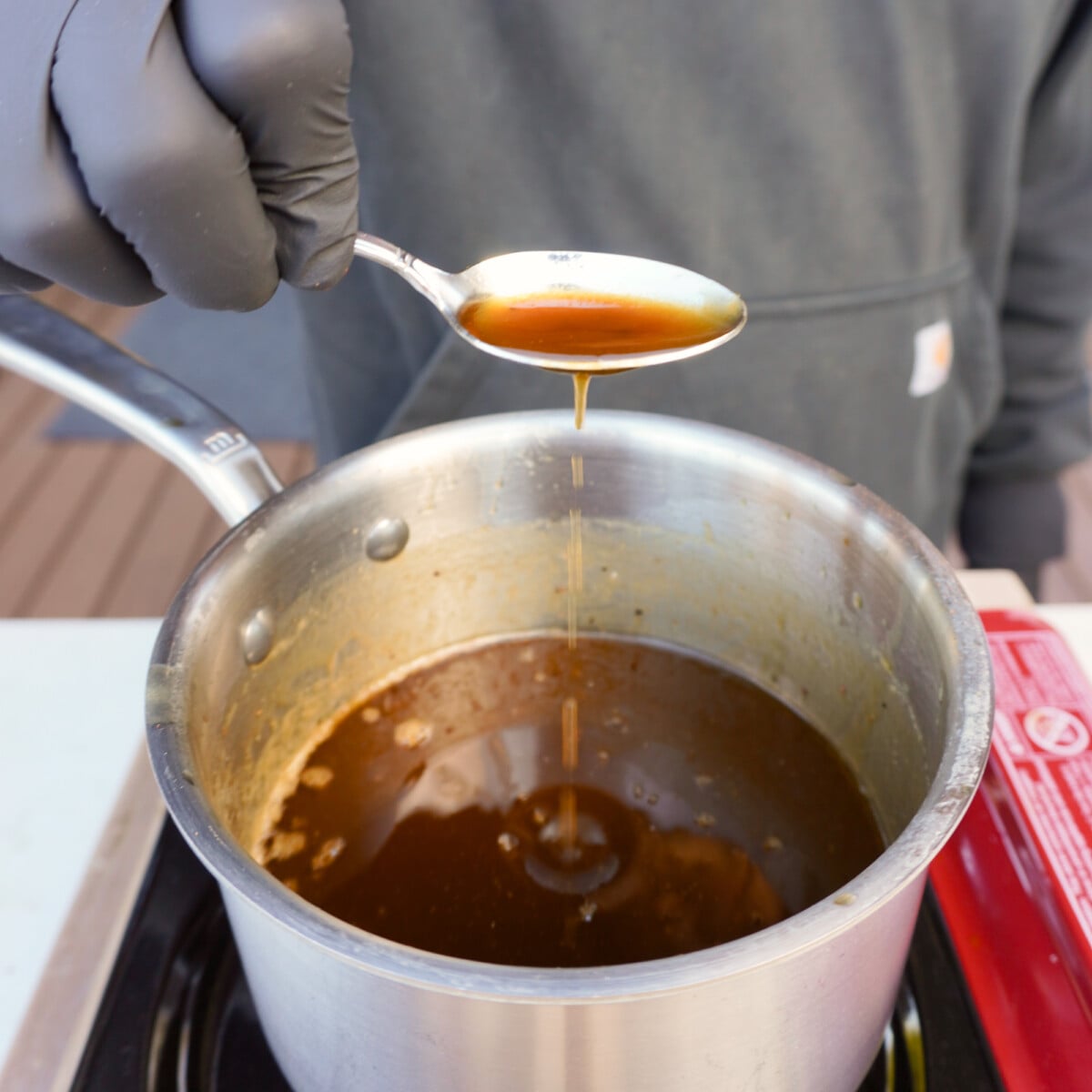 homemade whiskey butter sauce in saucepan.