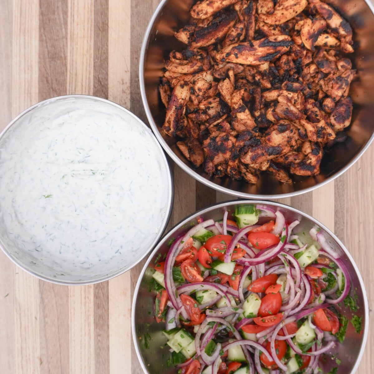 individual grilled chicken shawarma meal pieces.