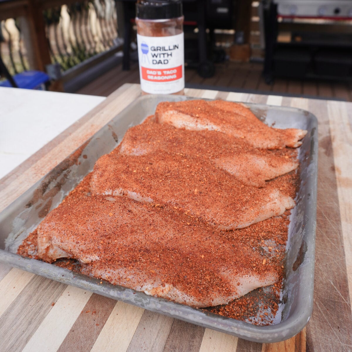 raw chicken breast seasoned with taco seasoning.