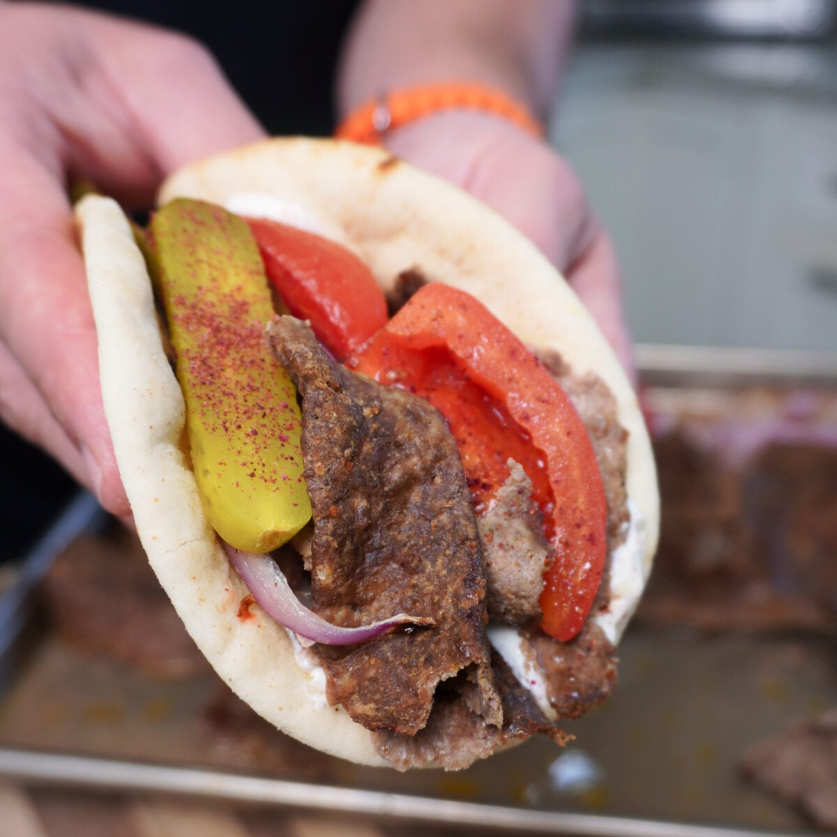 Sheet Pan Beef Kebabs packed and presented in a pita bread.