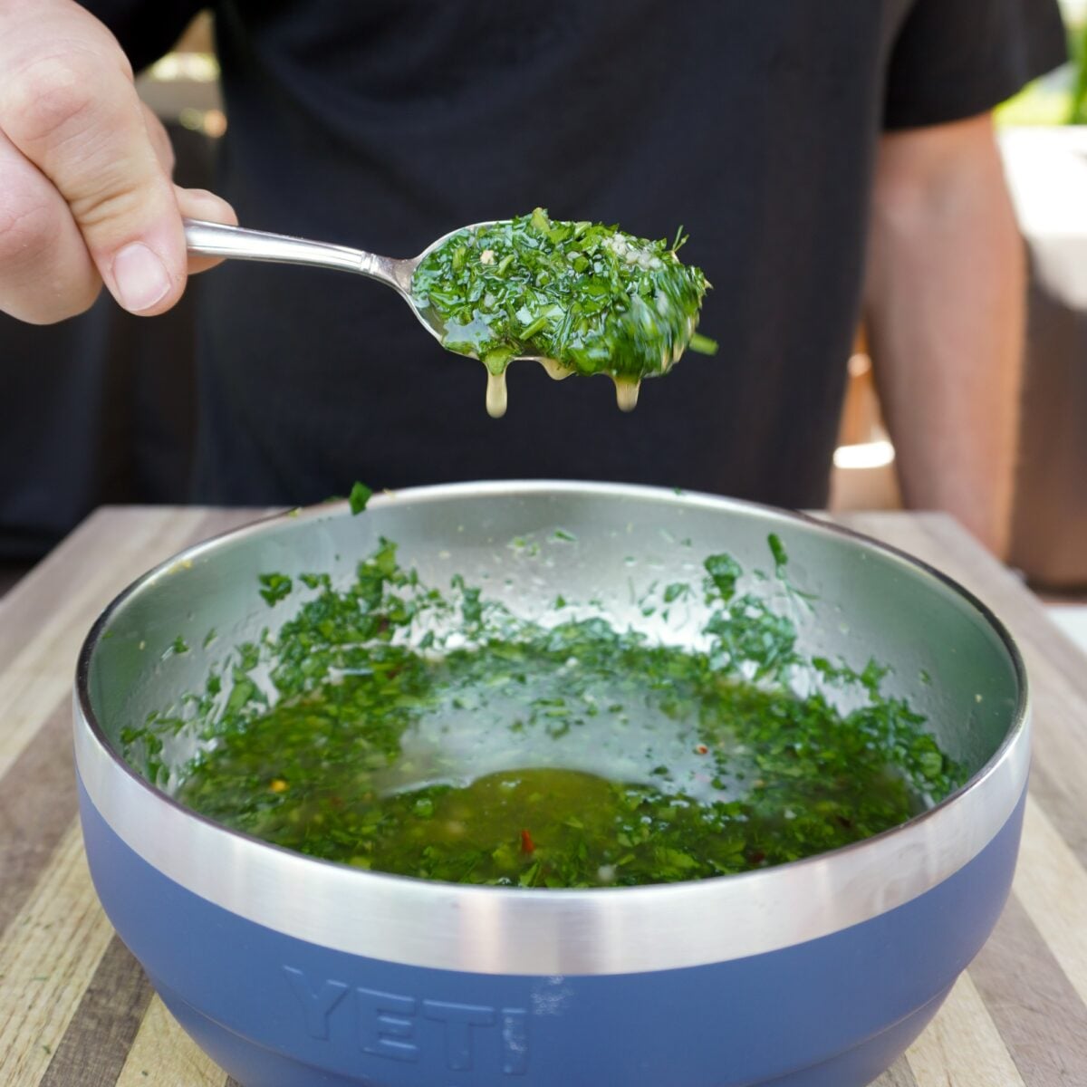dill chimichurri in a blue bowl.
