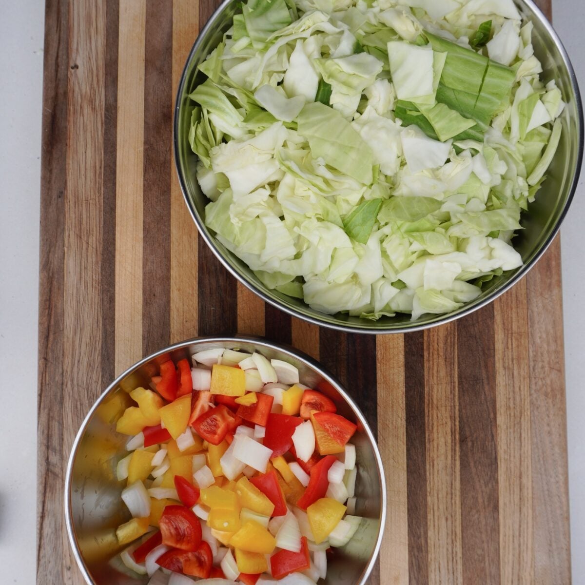 Chopped veggies in bowls.