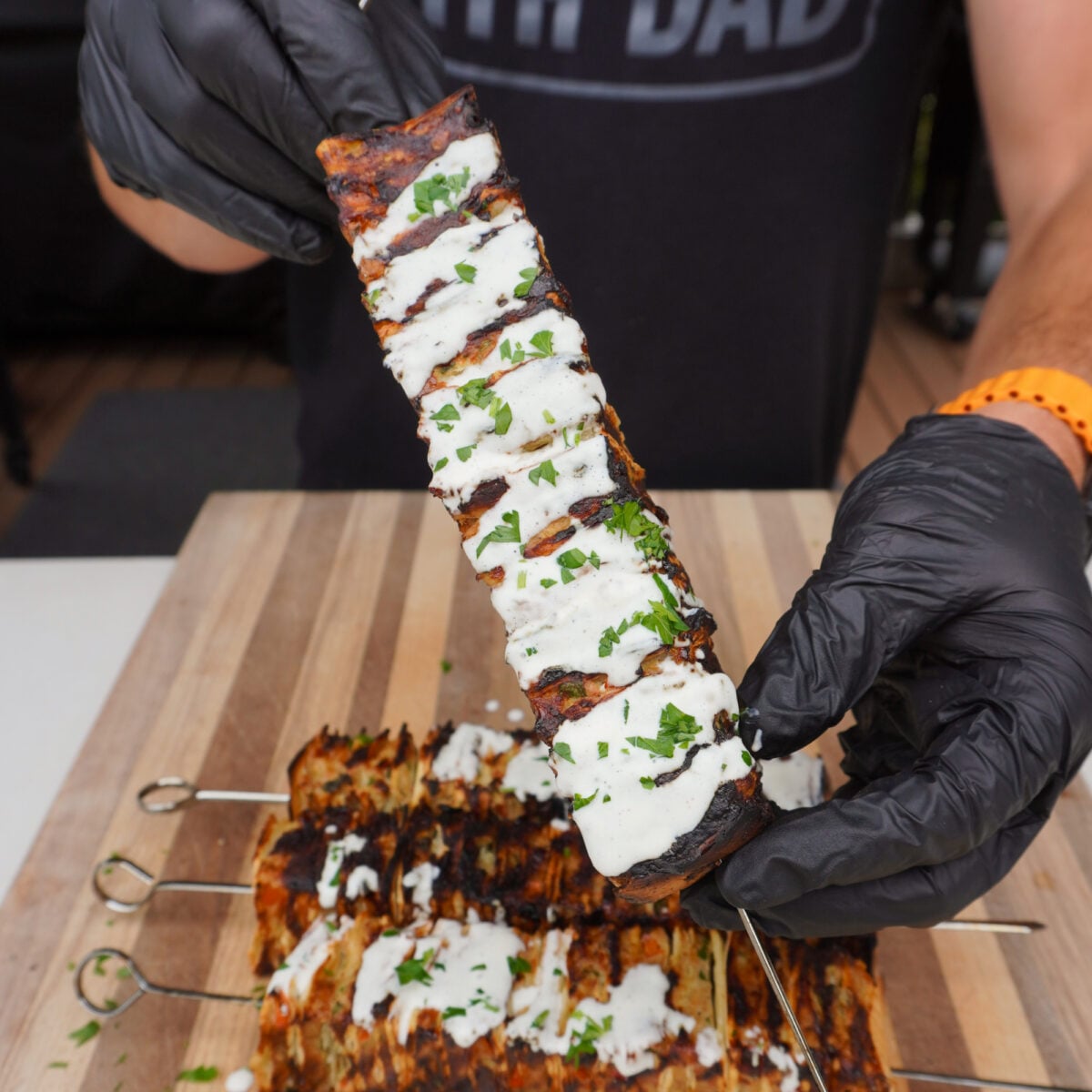 presenting the chicken kebab.