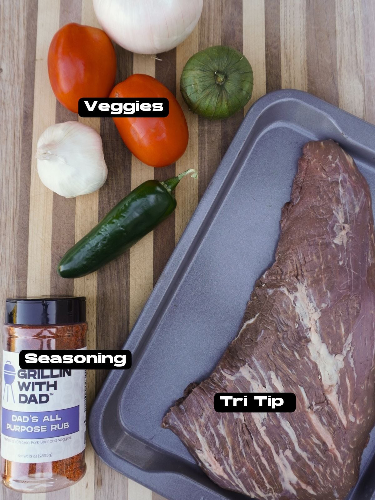 California style tri tip sandwich ingredients on a cutting board.