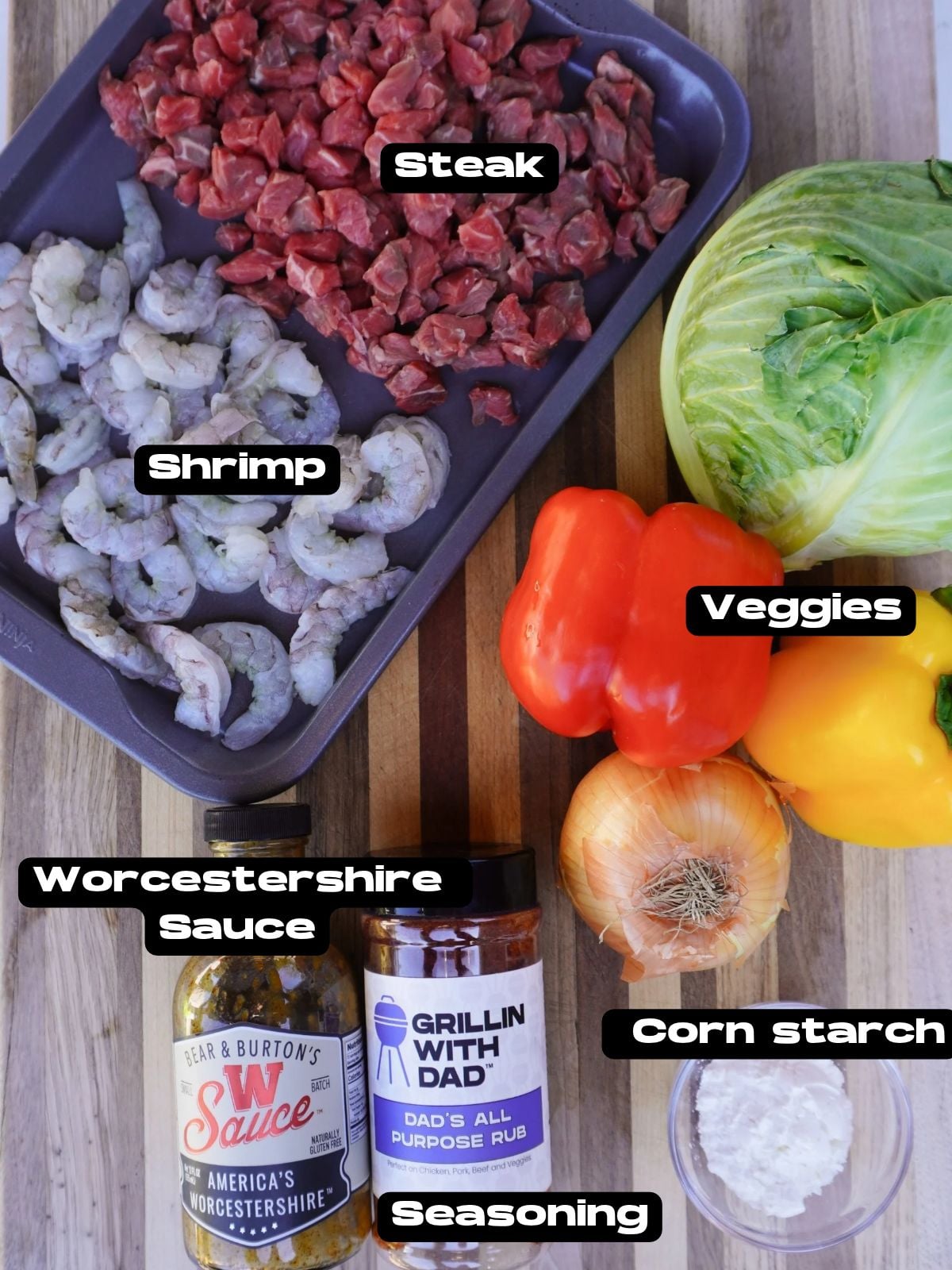 Surf and Turf Dirty Cabbage recipe ingredients on a cutting board.