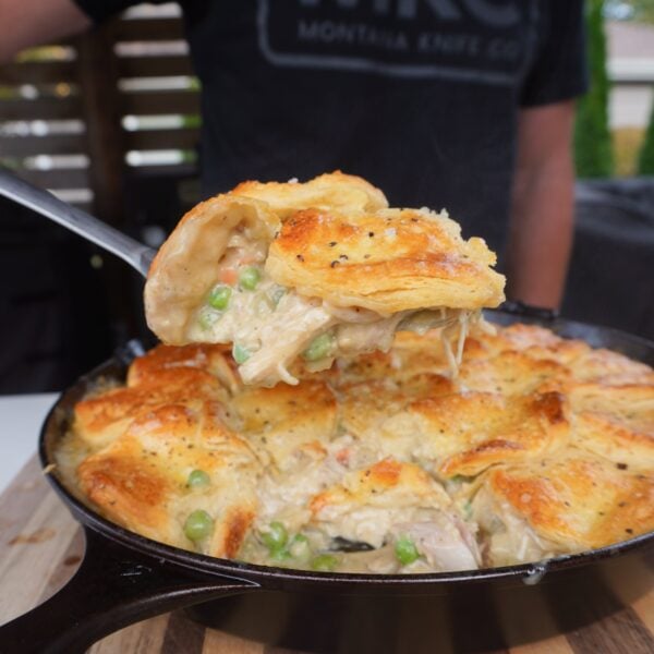 smoked chicken pot pie scooped up in ladle.