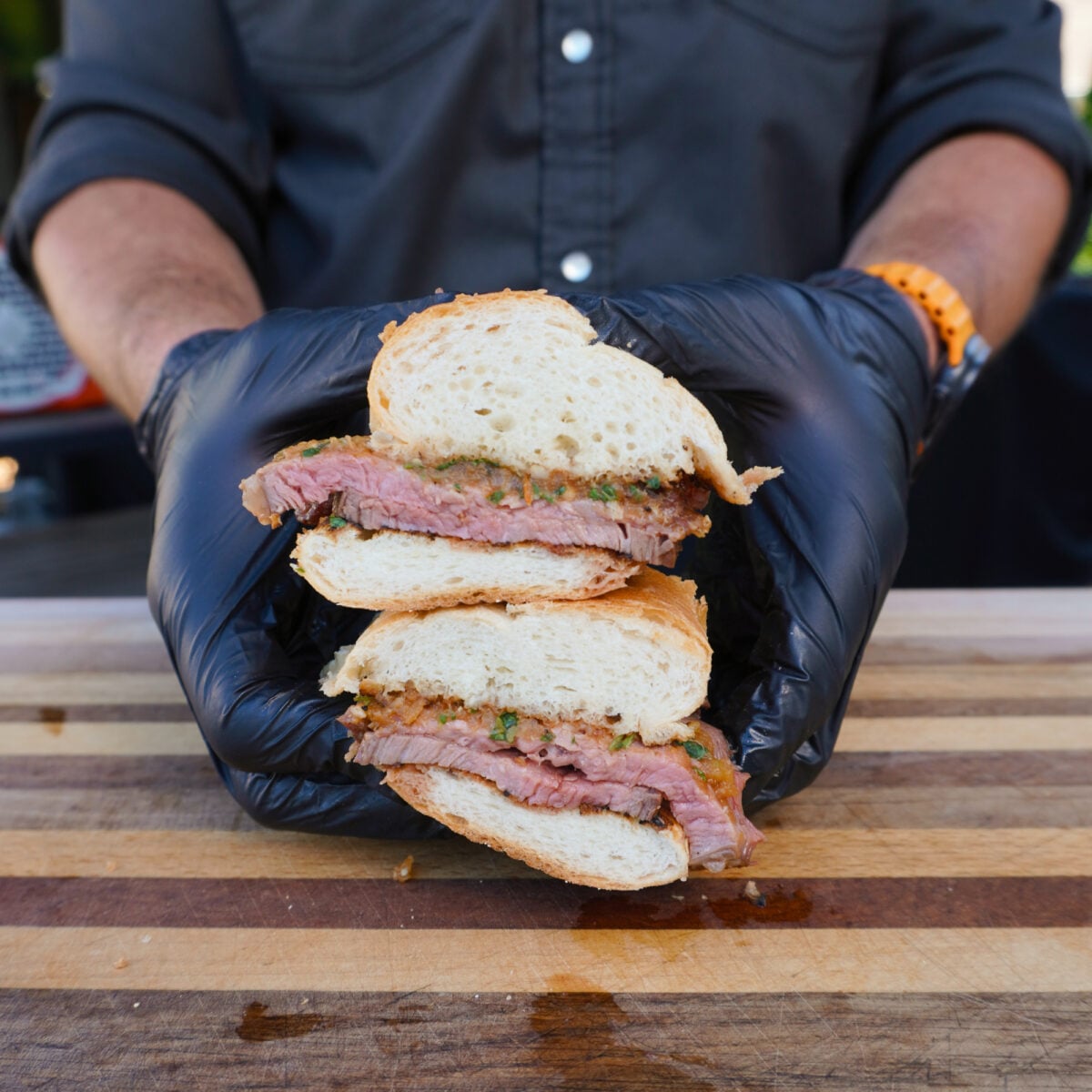 California style tri tip sandwich cut in half.